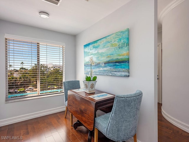 dining room featuring baseboards and wood finished floors