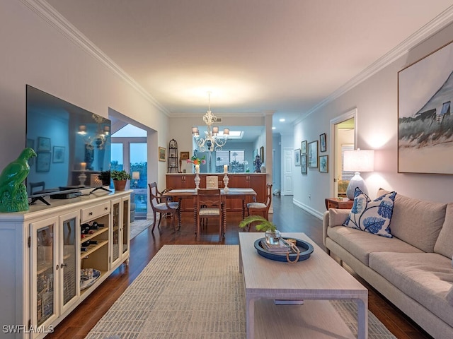 living room featuring baseboards, an inviting chandelier, crown molding, and dark wood finished floors