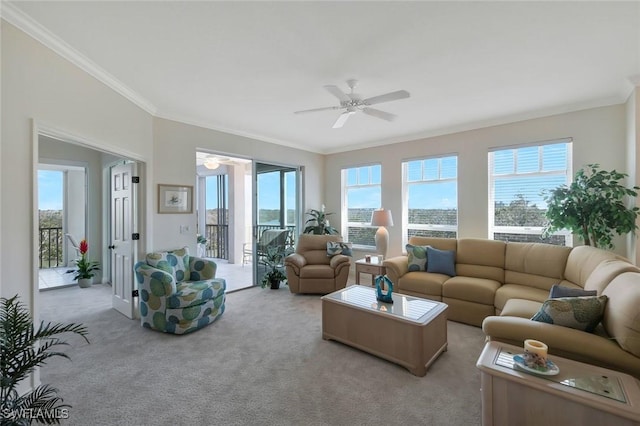 living room featuring plenty of natural light, light colored carpet, and ceiling fan