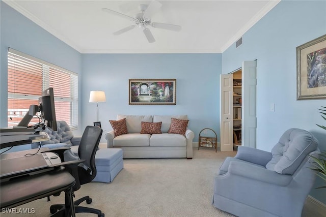 home office featuring visible vents, crown molding, baseboards, carpet flooring, and a ceiling fan