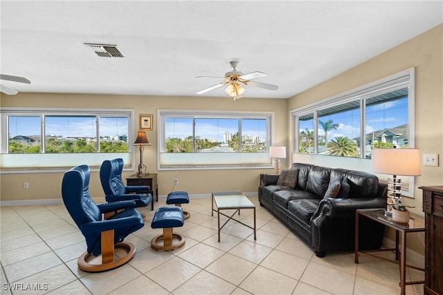 48 Fairview Blvd, Fort Myers Beach, FL 33931 - living area featuring light tile patterned floors, ceiling fan, visible vents, and baseboards