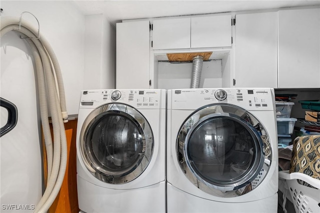 48 Fairview Blvd, Fort Myers Beach, FL 33931 - clothes washing area featuring cabinet space and washing machine and dryer