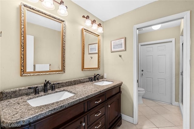 48 Fairview Blvd, Fort Myers Beach, FL 33931 - full bathroom featuring tile patterned flooring, a sink, double vanity, and toilet