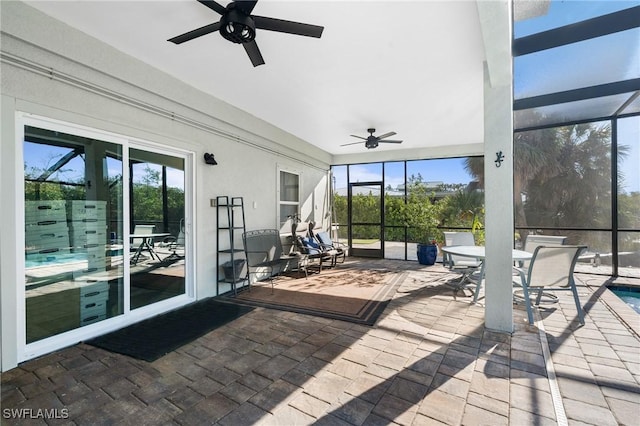 48 Fairview Blvd, Fort Myers Beach, FL 33931 - view of patio / terrace featuring outdoor dining area, glass enclosure, and ceiling fan