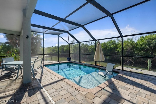 48 Fairview Blvd, Fort Myers Beach, FL 33931 - outdoor pool with glass enclosure and a patio area