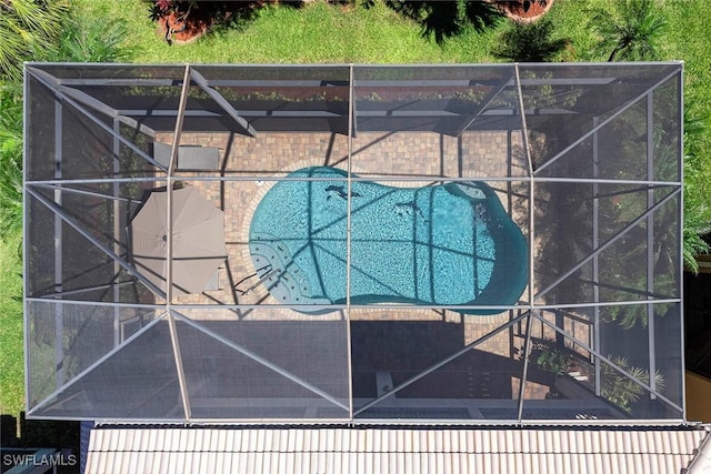 view of swimming pool with a lanai, a fenced in pool, and a patio area