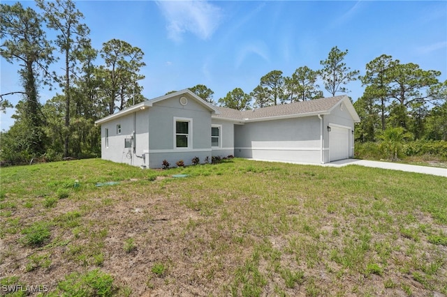 3906 E 10th St, Lehigh Acres, FL 33972 - ranch-style home featuring a garage, stucco siding, and a front lawn