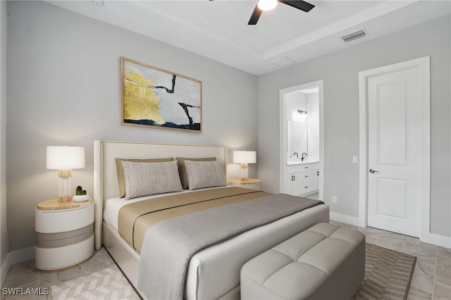 3906 E 10th St, Lehigh Acres, FL 33972 - bedroom featuring ensuite bathroom, baseboards, and a ceiling fan