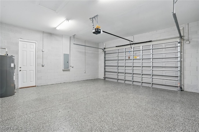 3906 E 10th St, Lehigh Acres, FL 33972 - garage with water heater, electric panel, and concrete block wall