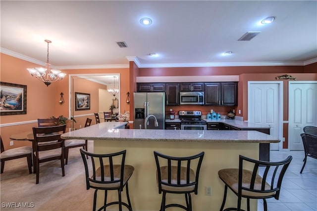20695 Country Barn Dr, Estero, FL 33928 - kitchen featuring visible vents, light stone countertops, a breakfast bar area, an inviting chandelier, and stainless steel appliances