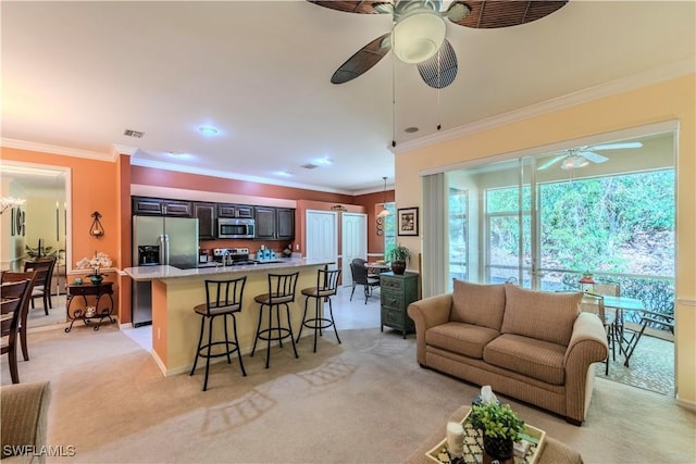 20695 Country Barn Dr, Estero, FL 33928 - living area featuring crown molding, light carpet, visible vents, and ceiling fan