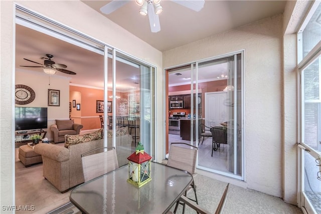 20695 Country Barn Dr, Estero, FL 33928 - dining space with a ceiling fan and crown molding