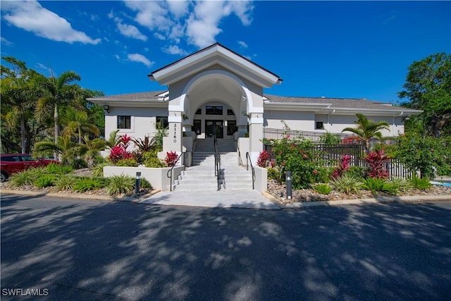 20695 Country Barn Dr, Estero, FL 33928 - view of front of property with fence and stucco siding