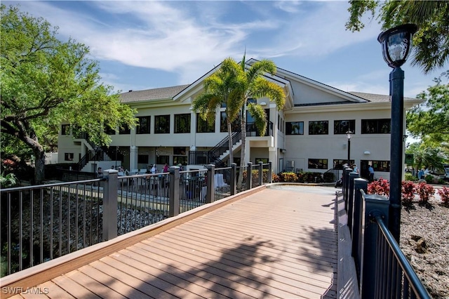 20695 Country Barn Dr, Estero, FL 33928 - back of property featuring stairs and stucco siding