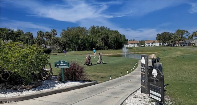 20695 Country Barn Dr, Estero, FL 33928 - view of property's community with a lawn