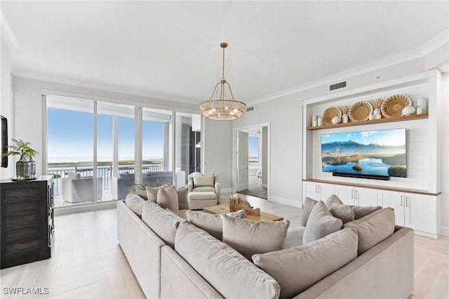 4971 Bonita Bay Blvd Unit Ph2503, Bonita Springs, FL 34134 - living room featuring a chandelier and crown molding