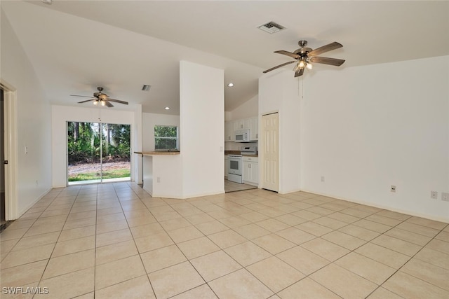 unfurnished living room with light tile patterned flooring, ceiling fan, vaulted ceiling, and visible vents