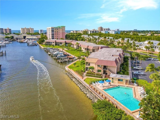 aerial view featuring a view of city and a water view