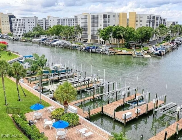 dock area with a water view and boat lift