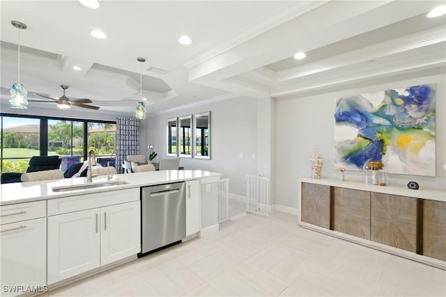 kitchen featuring a sink, a raised ceiling, dishwasher, a ceiling fan, and open floor plan