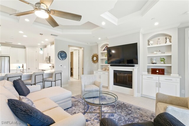 living area featuring ceiling fan, visible vents, crown molding, a glass covered fireplace, and recessed lighting