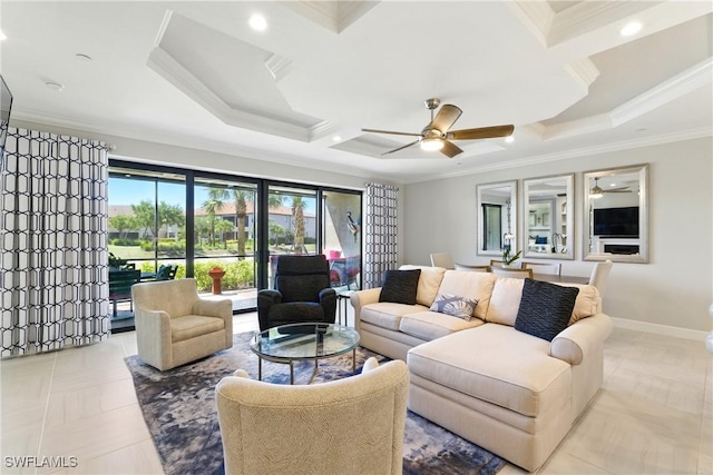living area featuring coffered ceiling, ornamental molding, and a ceiling fan