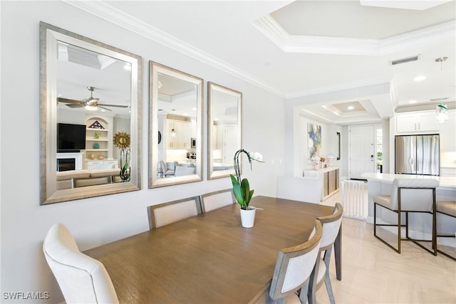 9654 Montelanico Loop Unit 102, Naples, FL 34119 - dining space with crown molding, a raised ceiling, and ceiling fan