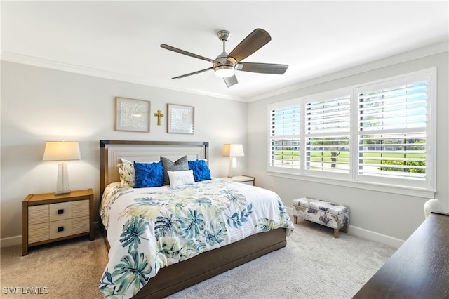 bedroom with baseboards, carpet flooring, ceiling fan, and ornamental molding