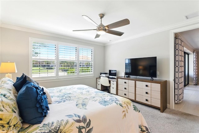 carpeted bedroom featuring a ceiling fan, baseboards, visible vents, and ornamental molding