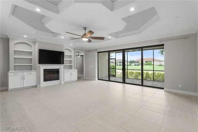9654 Montelanico Loop Unit 102, Naples, FL 34119 - unfurnished living room with crown molding, baseboards, built in shelves, a glass covered fireplace, and ceiling fan