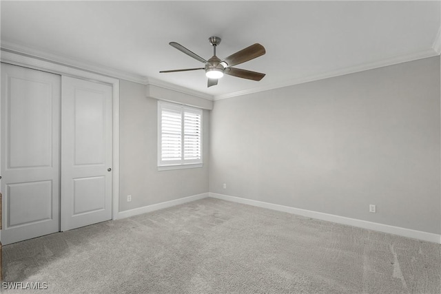 9654 Montelanico Loop Unit 102, Naples, FL 34119 - unfurnished bedroom featuring crown molding, carpet, baseboards, a closet, and a ceiling fan