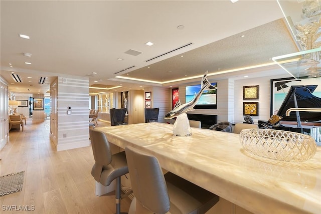 dining room with recessed lighting, visible vents, and light wood-type flooring