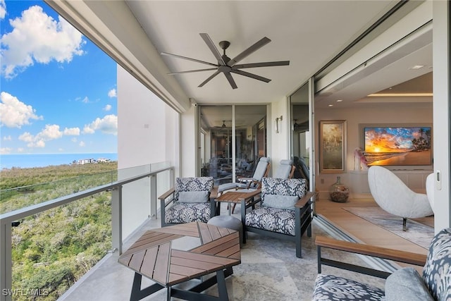 balcony featuring an outdoor hangout area and ceiling fan