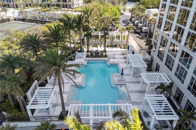 pool with stairway and a patio