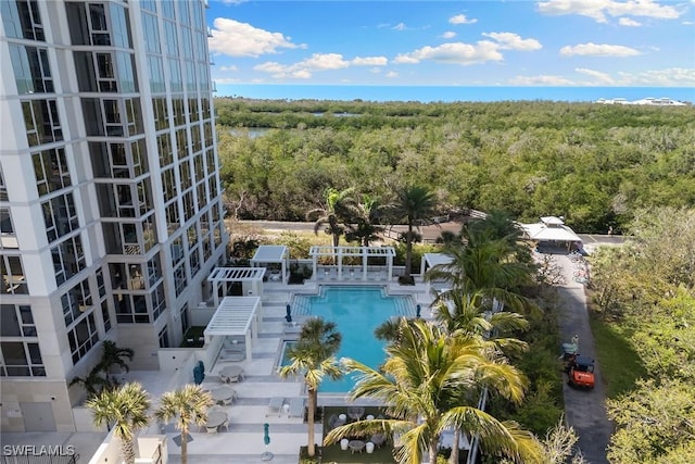exterior space featuring a view of trees and a water view