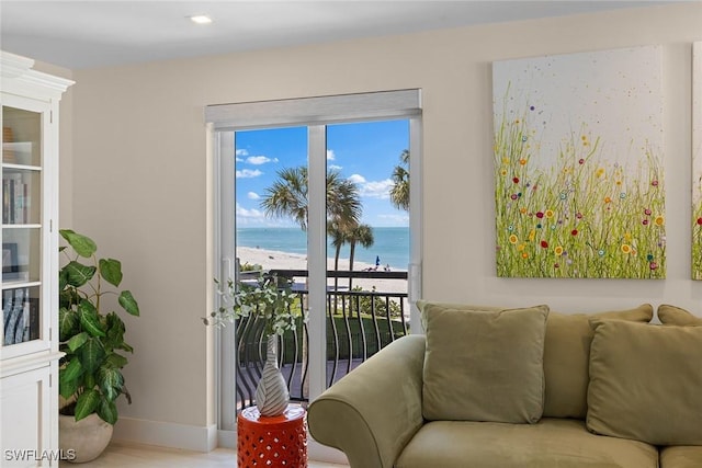 3333 Gulf Shore Blvd N Unit 4, Naples, FL 34103 - living area with baseboards, a water view, and a view of the beach