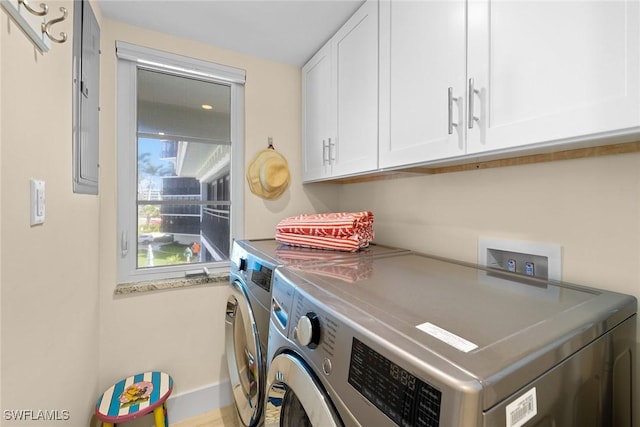 3333 Gulf Shore Blvd N Unit 4, Naples, FL 34103 - washroom with cabinet space and washer and clothes dryer
