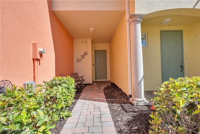 doorway to property with stucco siding