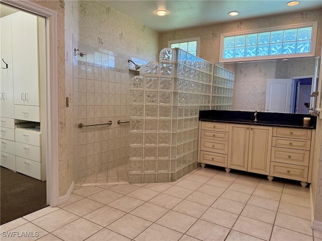 234 W Circle Dr, Clewiston, FL 33440 - bathroom with tile patterned floors, wallpapered walls, vanity, and walk in shower
