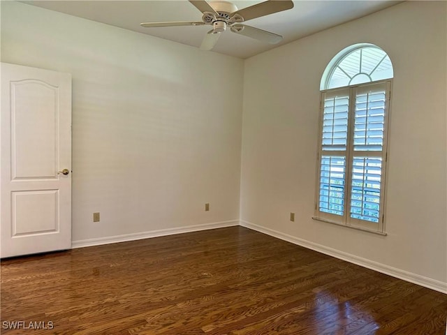234 W Circle Dr, Clewiston, FL 33440 - unfurnished room with dark wood finished floors, a ceiling fan, and baseboards