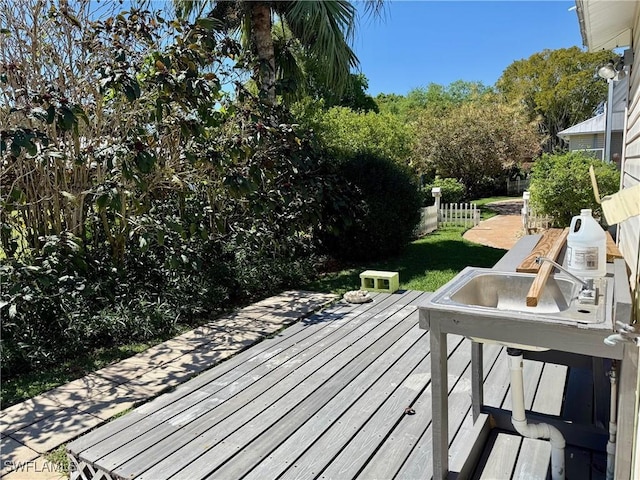 234 W Circle Dr, Clewiston, FL 33440 - wooden deck with fence and a lawn