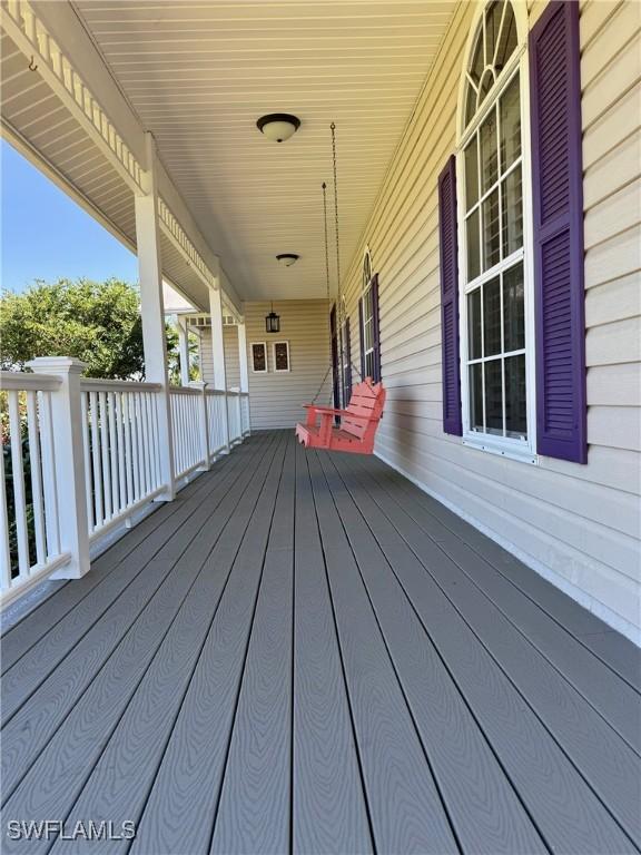 234 W Circle Dr, Clewiston, FL 33440 - wooden terrace featuring covered porch