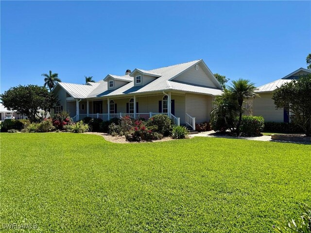 234 W Circle Dr, Clewiston, FL 33440 - view of front facade with a front yard and covered porch