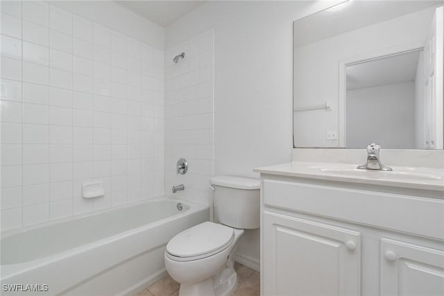 bathroom with shower / bathing tub combination, tile patterned floors, toilet, and vanity