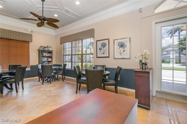 dining space with coffered ceiling, light tile patterned flooring, ornamental molding, and a ceiling fan