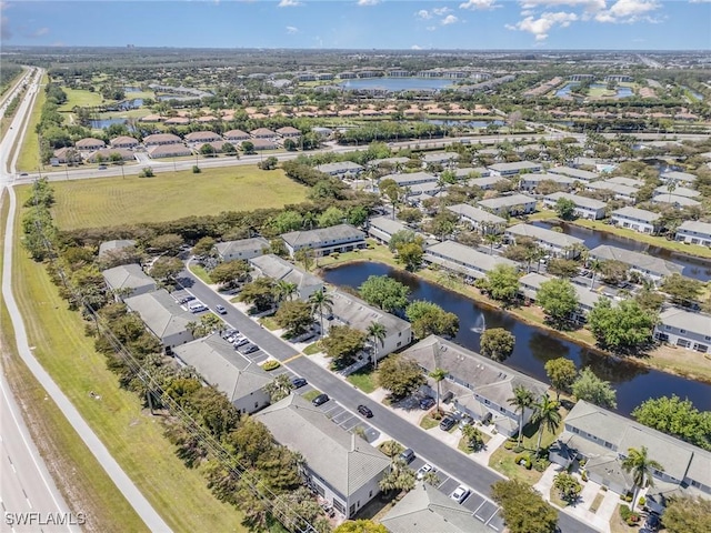 aerial view featuring a residential view and a water view