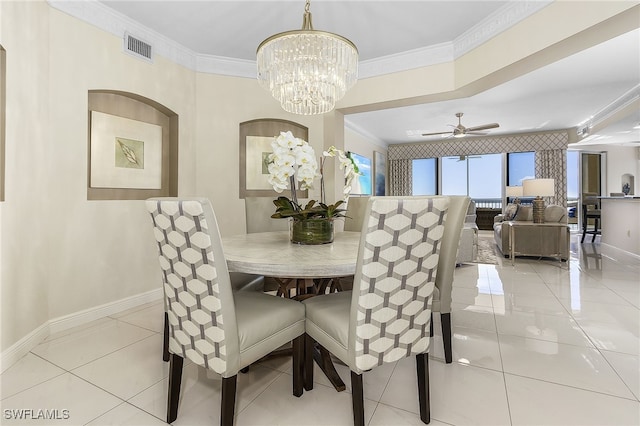 dining space with visible vents, baseboards, ornamental molding, ceiling fan with notable chandelier, and light tile patterned flooring