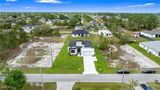 3808 10th St SW, Lehigh Acres, FL 33976 - birds eye view of property featuring a residential view