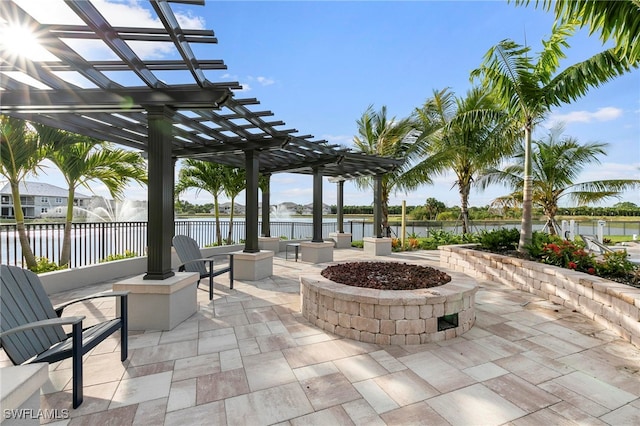 238 Indies Dr E Unit 101, Naples, FL 34114 - view of patio with a pergola, a water view, an outdoor fire pit, and fence