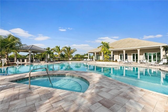 238 Indies Dr E Unit 101, Naples, FL 34114 - community pool featuring a gazebo, a community hot tub, and a patio area